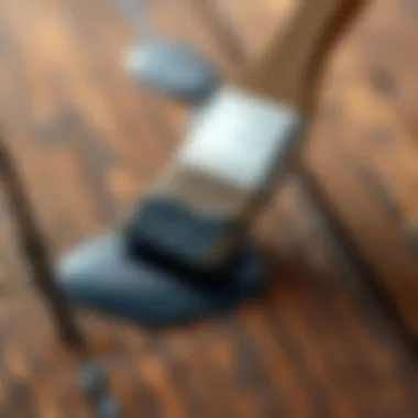 Brush applying enamel paint on a wooden surface