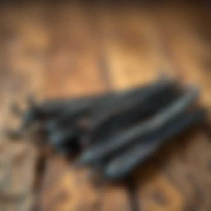 Aromatic vanilla beans arranged on wooden surface