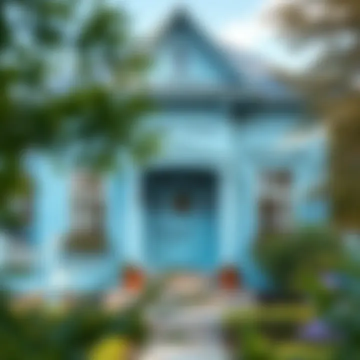 An elegant exterior of a house adorned with light blue paint, blending with nature